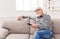 Calm senior man watching tv copy space