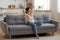 Calm serene young woman relaxing on couch at home