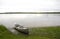 Calm Shore and Canoe at Dusk