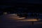 Calm Skiing resort during the night. Winter holiday in the mountains, foggy mountain forest, snow and skiing.