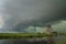 Calm before the storm. Windmill and dramatic green sky below a shelfcloud of a severe thunderstorm in The Netherlands