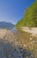 Calm Stream Emptying into an Alpine Lake