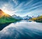 Calm summer scene of Bachalpsee lake with Schreckhorn and Wetterhorn peacks on background.