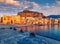 Calm sunday evening in Cefalu town. Amazing sunset on Mediterranean sea, Sicily, Italy, Europe.