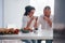 Calm time spending. Senior man and his wife in white shirt have romantic dinner on the kitchen