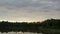 Calm Before Twilight: Serene Lake Against a Textured Sky
