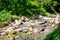 Calm water stream around the rocks