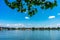 Calm water surface with a city skyline and Theodor Heuss Bridge in Mainz, Germany