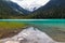 Calm waters of Lower Joffre Lake transform from teal & turquoise