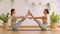 Calm of wellness Couple Asian young woman sit on yoga mat doing breathing exercise yoga boat pose or diamond shape together.Yoga