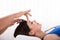 Calm Woman Receiving Reiki Treatment