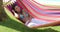 Calm young woman in hammock