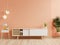 Calming Coral wall background, a modern living room decor with a tv cabinet
