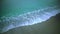 Calming view of sea waves washing sand beach, relaxing background, slow motion