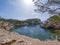 Calo den Monjo sea inlet and cove, cliffs and pine tree forest of the Mallorca coast, Balearic island, Spain