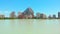 Calpe, Spain - July 3, 2020: Urban skyline Penon de Ifach or Penyal de Ifac rock, salt lake with flock of flamingos birds real