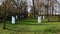 Calvary with small chapel from 1925 nd white Stations of the Cross hidden in circle of naked broadleaf trees, winter season