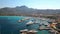 Calvi beach and old town with turquoise clear ocean water in harbor with boats and yachts, Corsica, France