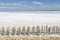 Camargue white salt flat lake, etang salt water lagoon surrounded by sand dunes, Southern France