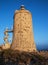 Camarinal lighthouse in Zahara de los Atunes Cadiz with blue sky and sunset light