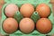 Camberley, UK - Dec 31 2016: Brown eggs in green carton with British Egg Tracking Code and Lion Brand