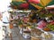 Cambodia food fruit market variety of fruits with colorful umbrella shades