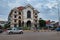 Cambodia, Siem Reap 12/08/2018 Motor traffic on a city street in southeast Asia, cloudy weather, a large abandoned house