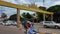 Cambodia, Siem Reap 12/08/2018 movement of vehicles on a city street, people on a motor scooter, a yellow arch with