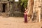 Cambodian Asian Girl in Khmer Dress by an Ancient Door and Tree in Angkor