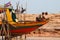 Cambodian floating village boat construction with kids playing