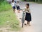 Cambodian girl with bycicle going to school