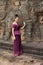 Cambodian Girl in Khmer Dress Standing at the Terrace of the Elephants in Angkor City