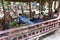 Cambodian guys resting under a gazebo in Phnom kulen national park, Cambodia