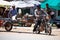 Cambodian people riding motorcycle and driving vehicle car and biking bicycle on street with traffic angkor wat road go to work at