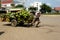 Cambodian seller moves coconut cart