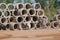 Cambodian street construction site with workers and concrete pipes