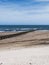 Cambois beach in Northumberland, UK with wind turbines