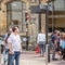 Cambridge, UK, August 1, 2019. Traveler reading directions at tourist attraction signpost with direction signs