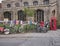 Cambridge, UK - October 9, 2019: Bicycles parked against the fence with a lot of posters