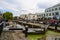 Camden Lock with tourists gathered waiting to watch narrow boats pass through