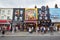 Camden Town colorful shops with people in London