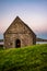 Camdles Burn Inside St Oran`s Chapel By the Sea at Dusk on the Isle of Iona Scotland