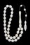 Camel bone rosary beads isolated on black background