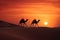Camel caravan in the Sahara desert at sunset. 3d rendering, Camel caravan on sand dunes on Arabian desert with Dubai skyline at