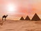 Camel and mysterious pyramids - 3D render