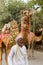 Camel owner with camels
