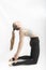 Camel Pose. Ustrasana. Young attractive woman practicing yoga. Slender girl is engaged in gymnastics. Vertical frame