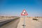 Camel sign in the desert of israel. empty road