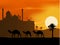 Camel trip silhouette with mosque background