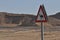 Camel warning sign on the road. Signage in the desert in Israel